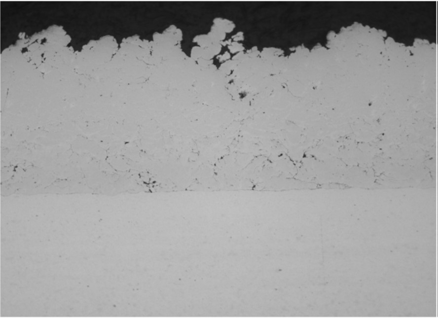 Laser Assisted Cold Spray, LACS.
Coating Titanium, Ti onto a steel tube.  Section showing structure of a high strength coating.